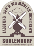 Schild mit Mühle der Gemeinde Suhlendorf
